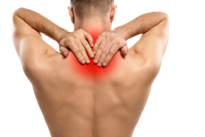 Anonymous man massaging aching spine Dolori collo