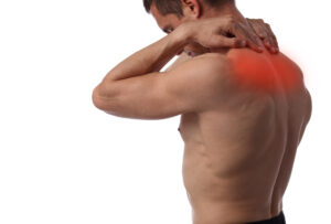 Muscular Man suffering from back and neck pain isolated on white background. Pain relief, chiropractic concept. Sport exercising injury Dolore dorsale