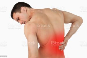 Back view of male suffering from back pain against a white background Dolore dorso lombare